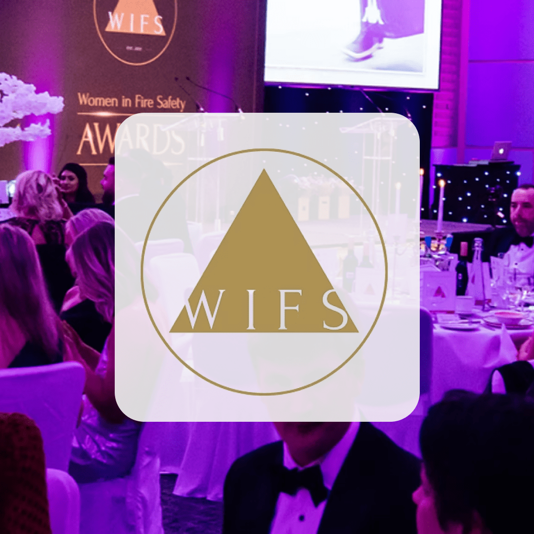 People in formal attire at the WIFS 2023 awards event with a Headline Partner logo overlay.