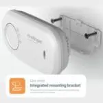 FA3313x4 White FireAngel alarm mounted on a wall with bracket and screws.