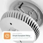 FA6720-R smoke alarm being installed onto a ceiling baseplate with two screws.