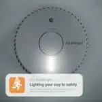 The FA6611-R smoke alarm features a glowing LED escape light and safety message beneath.