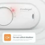 Close-up of FireAngel FA3820X4 CO alarm featuring red warning light and silence button.