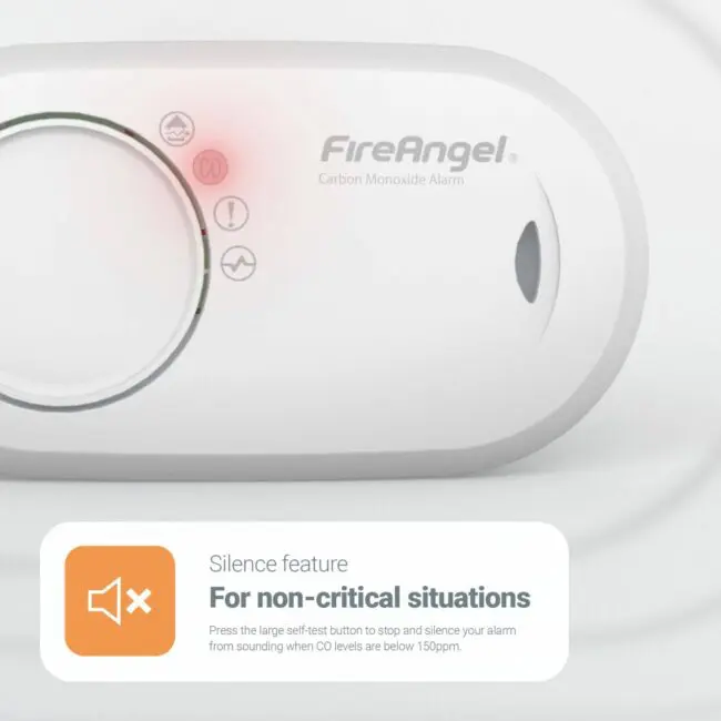 Close-up of FireAngel FA3820X4 CO alarm featuring red warning light and silence button.