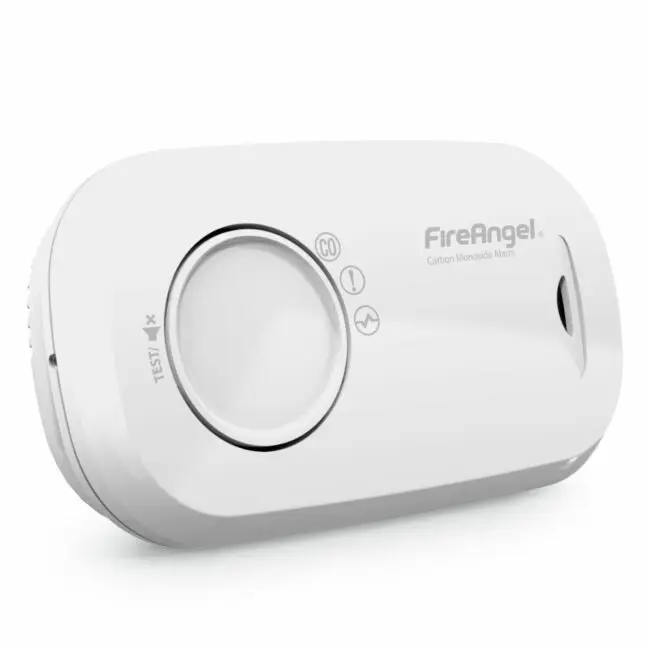 White FA3313x4 carbon monoxide alarm with test button and indicator lights, angled view.