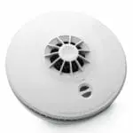 The HM-SN-1 is a round white smoke detector with vents and a test button on its surface.