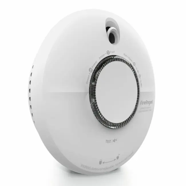 The SCB10-R is a white circular object with a round knob.