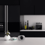 Modern black kitchen with knives, olive oil, and the FA3322 vase on the worktop.