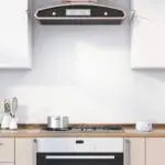 Modern kitchen with an FA3328-EUT cooker, pot, utensils, and a cooker hood over the hob.