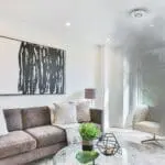Grey smoke fills the corner near FP2620W2-R in a modern living room with white walls.