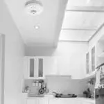 Modern white kitchen with skylight, cupboards, and an HW1-R on the ceiling.