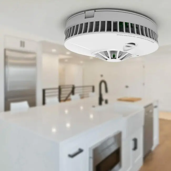FP1740W2-R smoke detector installed on the ceiling of a modern white kitchen.