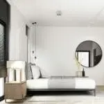Minimalist bedroom with a low ST-750T bed, round mirror, and modern neutral décor.