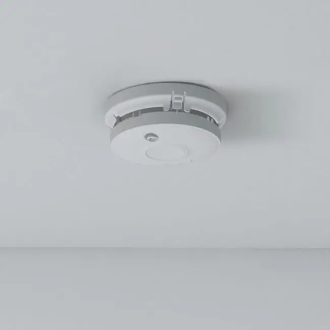 The SW1-PF-T smoke detector is mounted on a white ceiling.