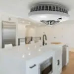 FP1720W2-R smoke detector installed on a modern kitchen ceiling.