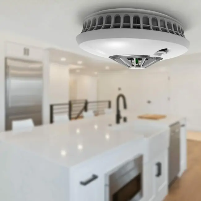 FP1720W2-R smoke detector installed on a modern kitchen ceiling.