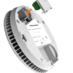 FS1521W2-T white smoke detector with a module being inserted (orange arrow shown).