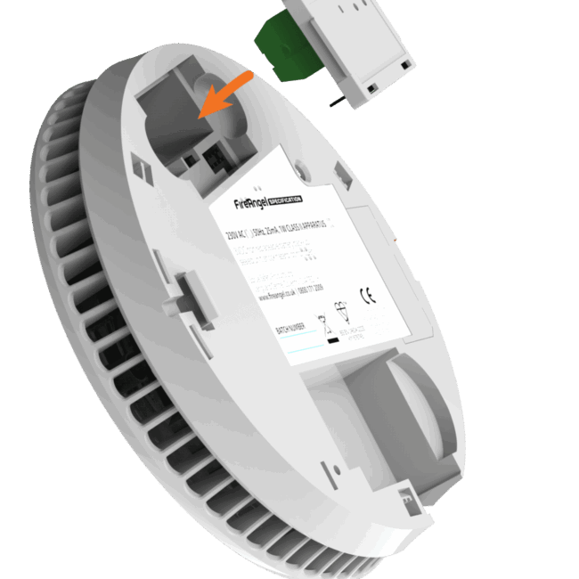 FS1521W2-T white smoke detector with a module being inserted (orange arrow shown).