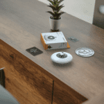 FP1720W2-R smoke detector kit with box and parts on a cupboard next to a potted plant.
