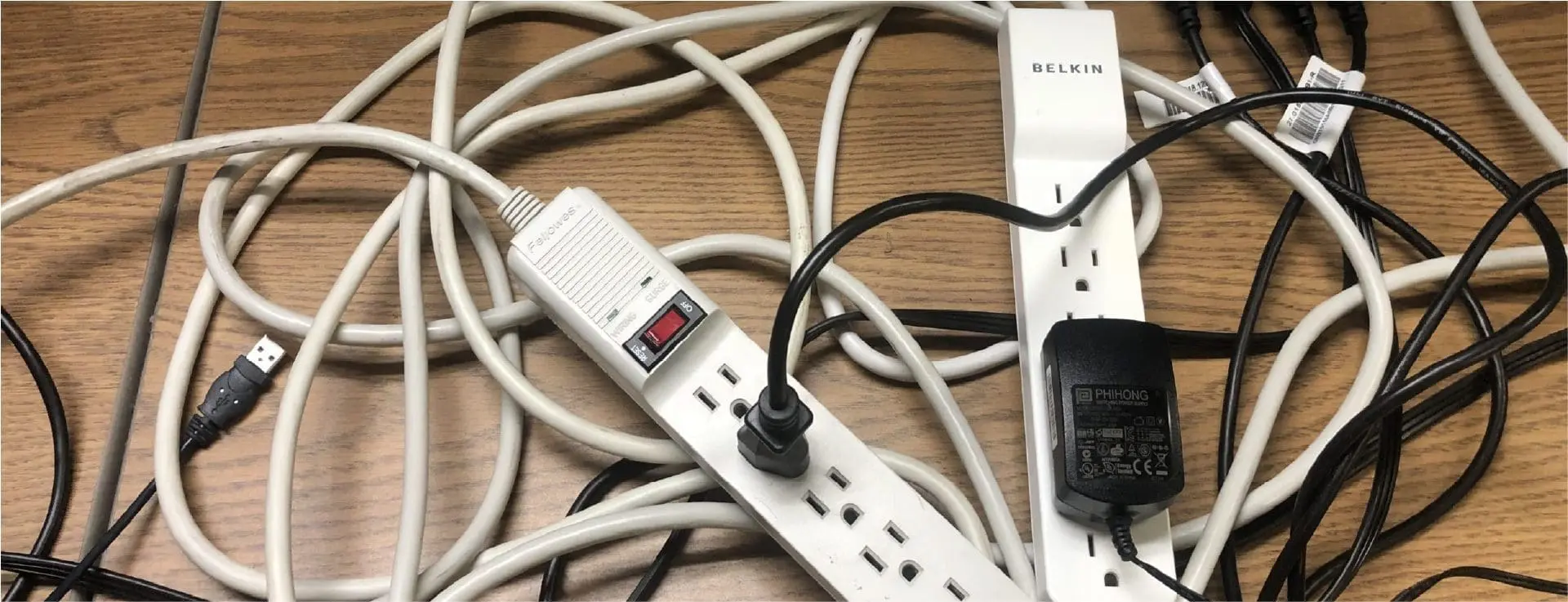 Tangled power strips and leads—learn how to prevent electrical fires on wooden surfaces.