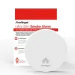 White FA6829S smoke alarm with slim CO alarm and red and white packaging in the background.