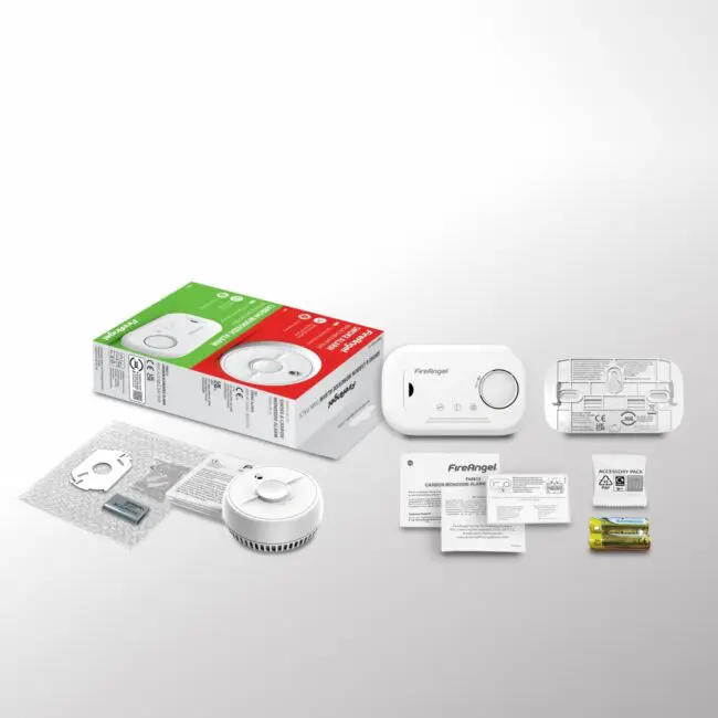 FA6813-SB1-T2 smoke and CO alarm kit includes devices, batteries, manuals, and packaging.