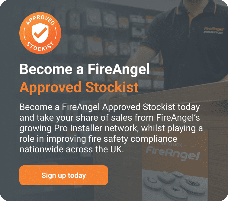 FireAngel dealer promo—register now! Fire safety products showcased on display table.