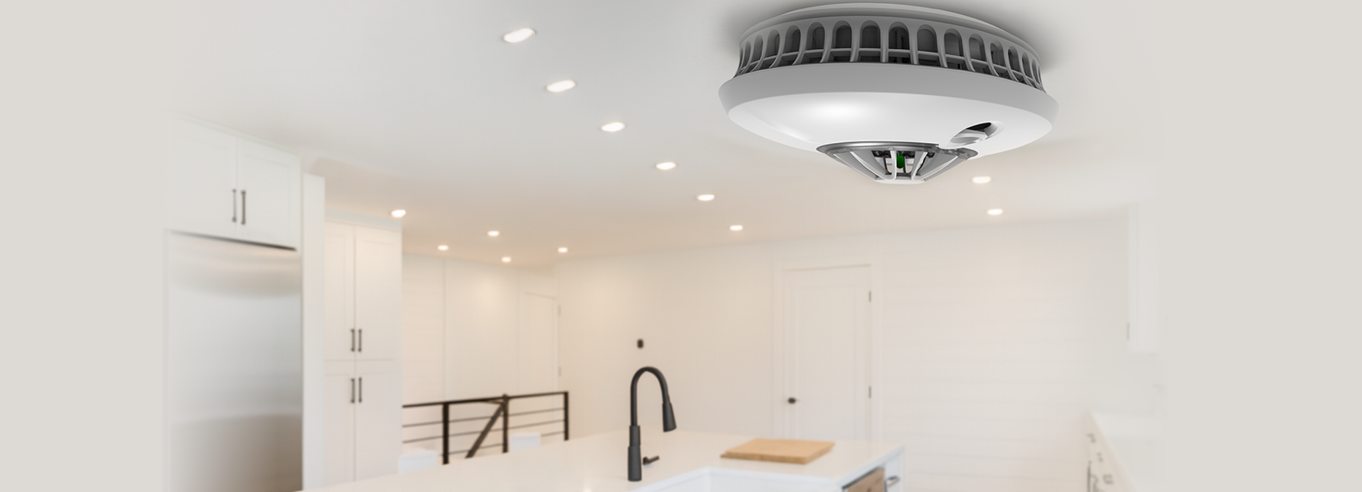A FireAngel Heat Alarm positioned inside of a modern kitchen 