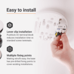 Hand connecting wires to Spec+ Multi-Sensor Alarm with installation instructions visible.