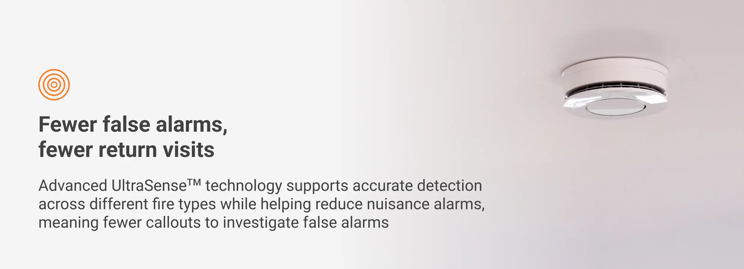 White smoke detector on ceiling with tips to minimise false alarms and speed up installation.