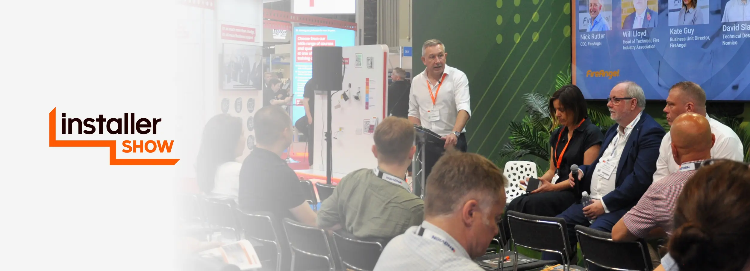 InstallerSHOW panel discussion with speakers and audience visible on stage.