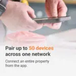 Hands holding an Angel Pro mobile showing text about pairing 50 devices on one network.